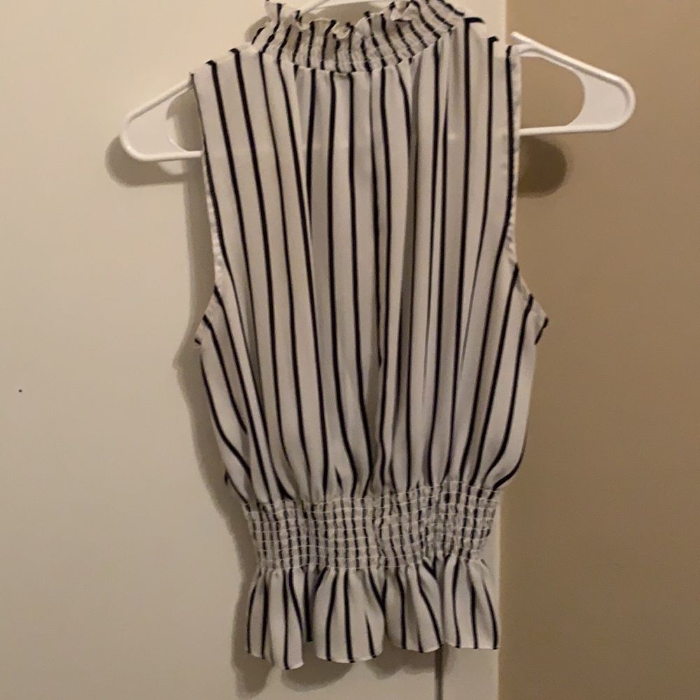 Turtle neck Peplum top.